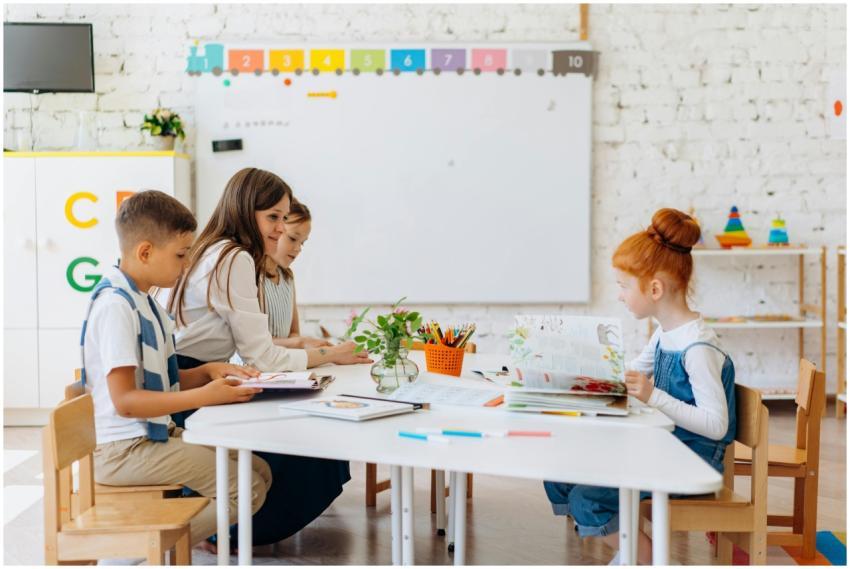 Students and teacher interacting in a bright, colo