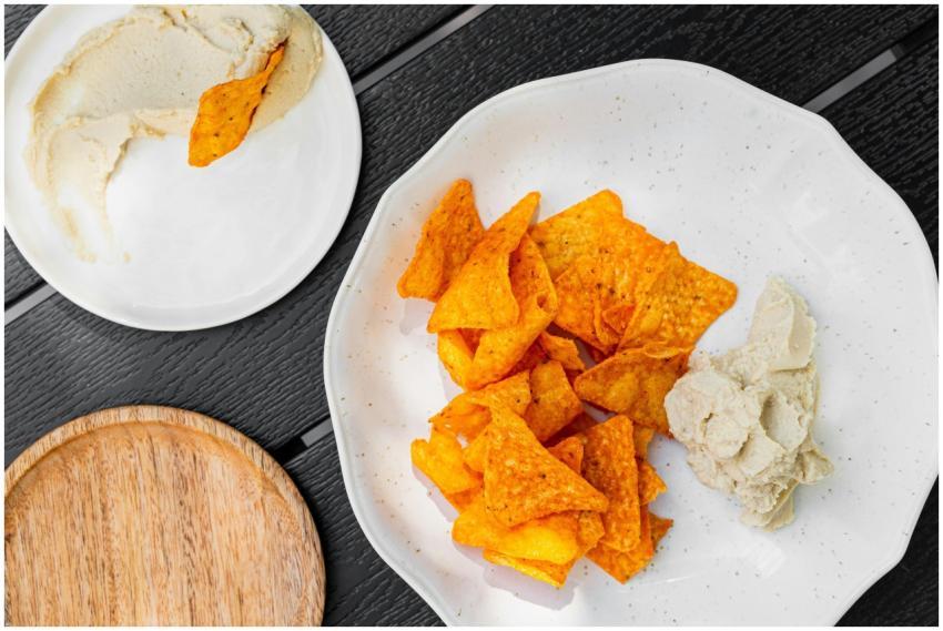 Delicious tortilla chips served with creamy hummus