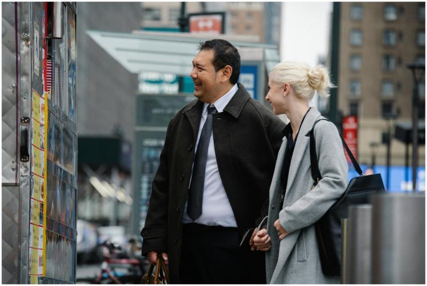 Mature man and woman in business clothes buying fo