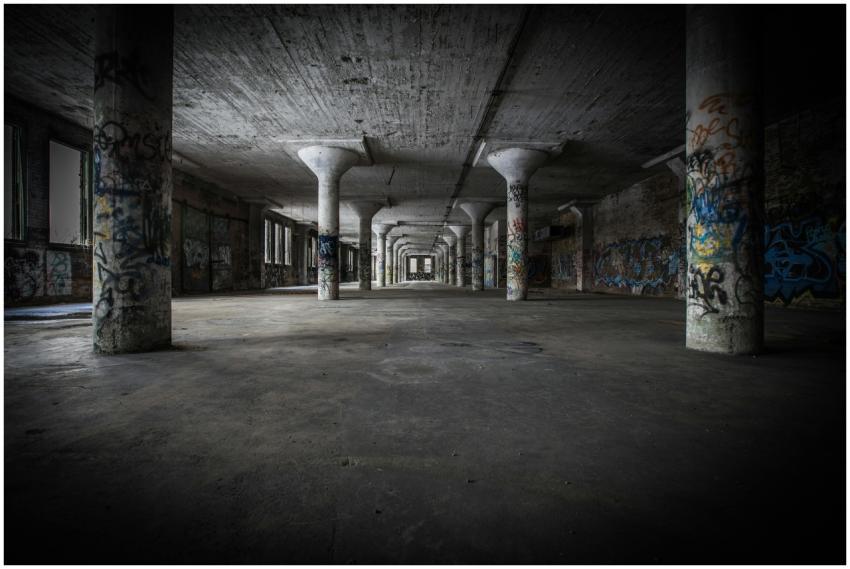 Moody interior of an abandoned warehouse featuring