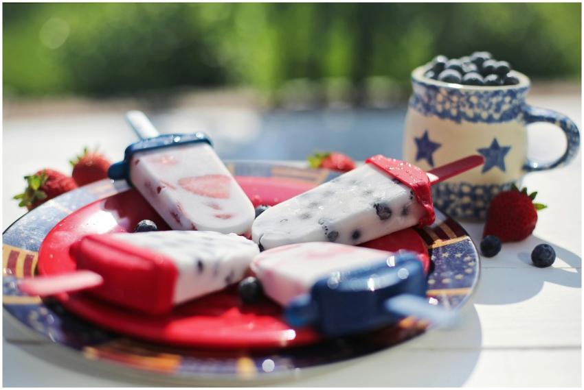 Colorful berry popsicles on a plate, perfect for a