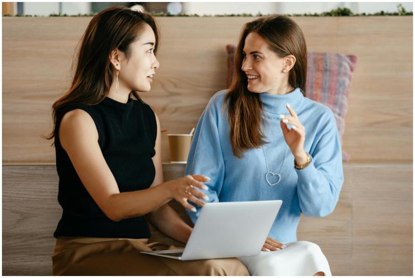 Young multiethnic business partners speaking about