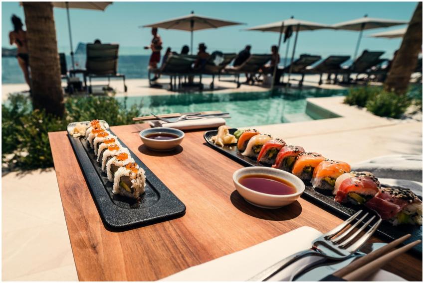 Delicious sushi rolls served by a poolside in sunn