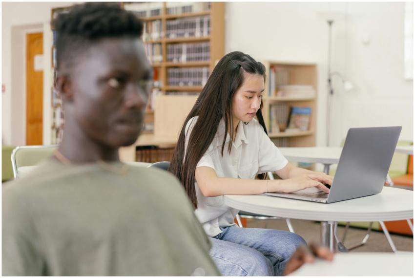 Two students focused on study in a contemporary li