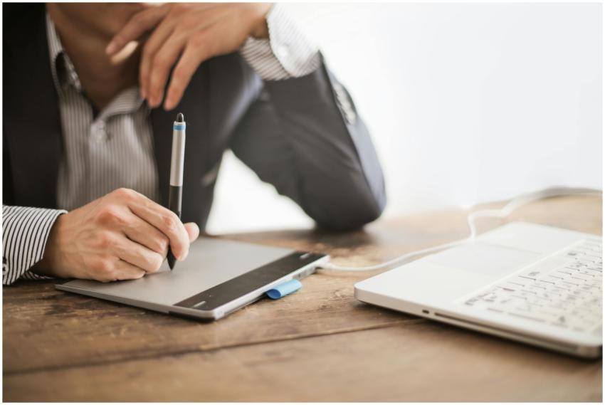 A professional working with a graphic tablet and l