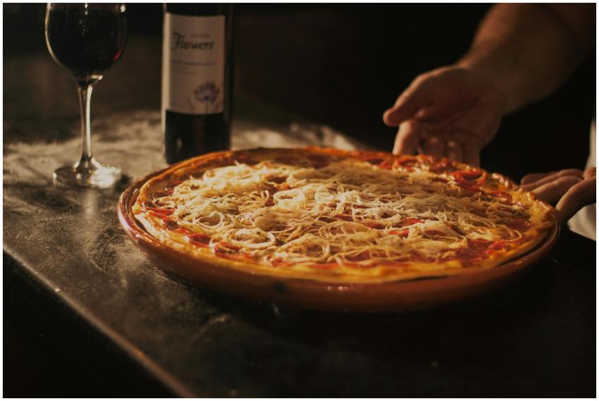 Delicious pepperoni pizza paired with red wine, sh