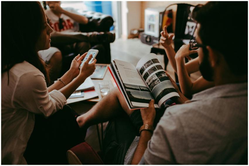 Casual group discussion with people reading a maga