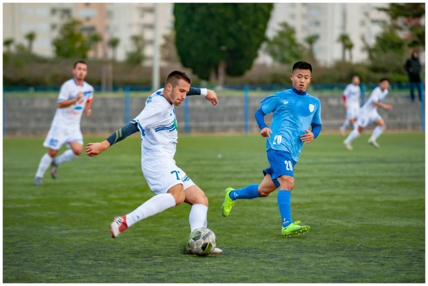 Football players in motion during a competitive so