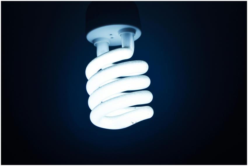 Close-up of a glowing spiral energy-saving bulb ag