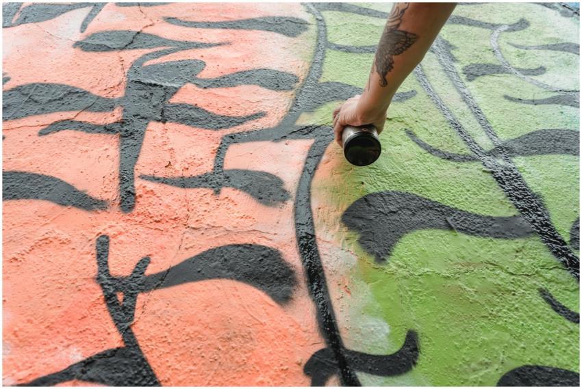 From below of crop anonymous talented painter with