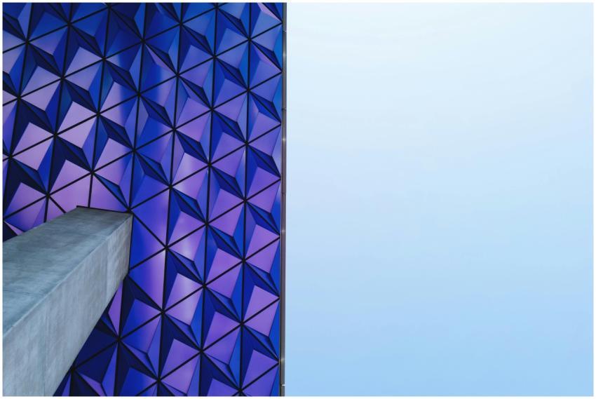 Futuristic geometric facade with blue and purple p