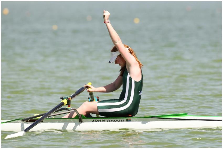 A female rower celebrates her victory in a vibrant