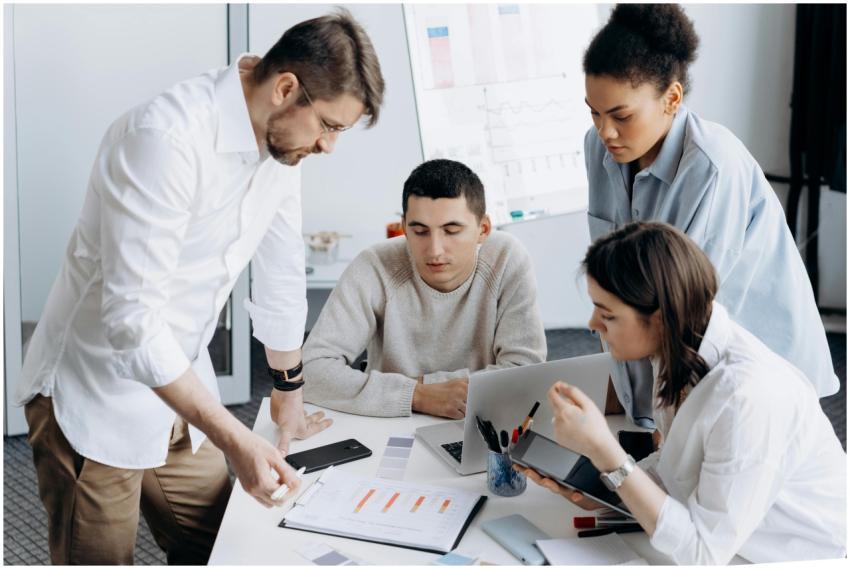 A group of professionals brainstorming and working