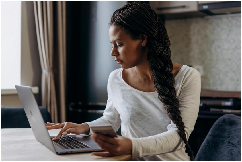 Young African American woman with braided hair mak