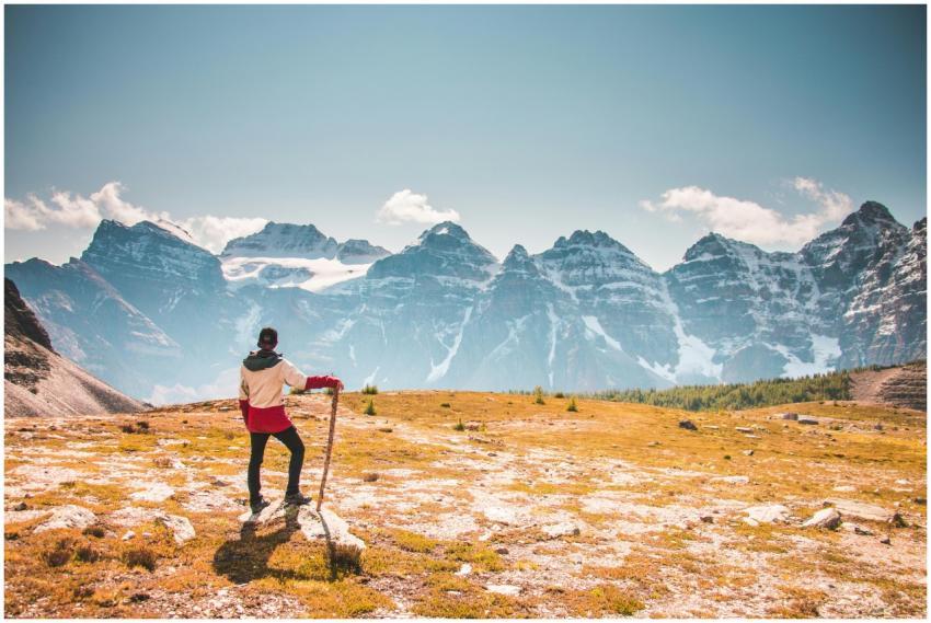 Hiker with a stick overlooking the beautiful Canad