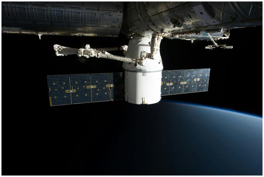 A SpaceX satellite hovering over Earth's horizon i