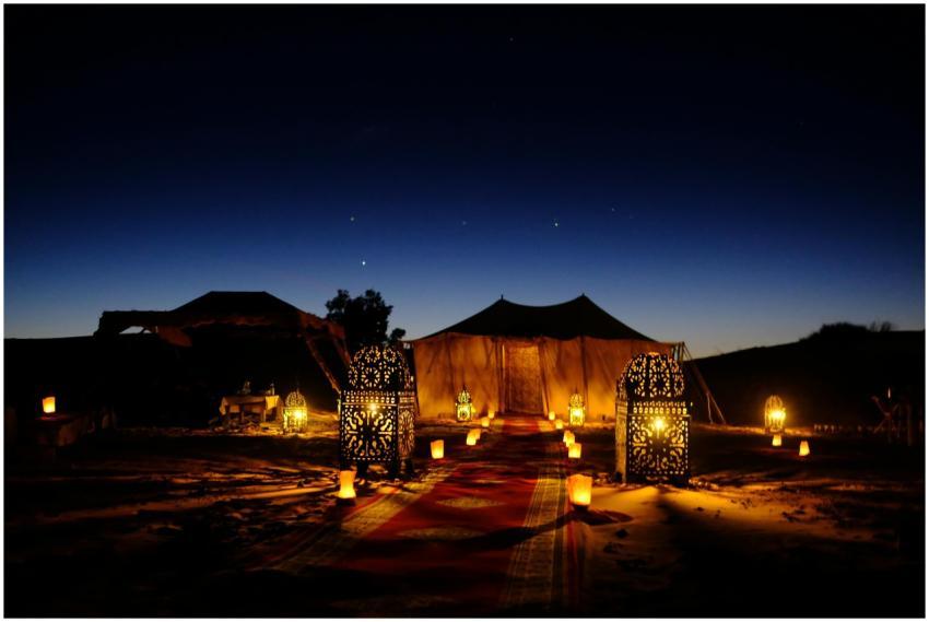 Illuminated tents with lanterns at twilight in Egy