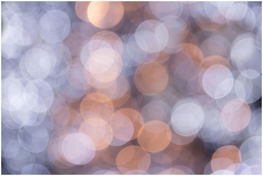 A soft-focus abstract image featuring circular bok