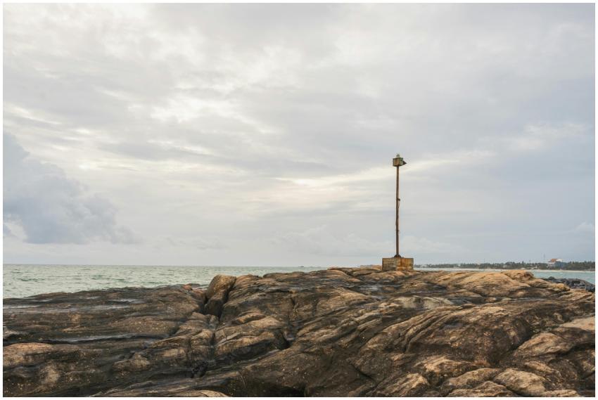 Peaceful coastal view of rocky shoreline and sea i