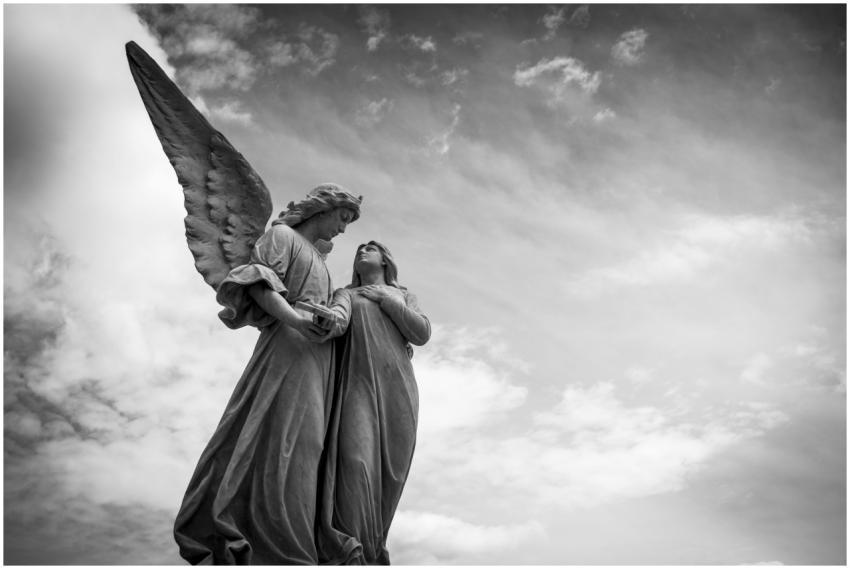 Striking black and white photo of angelic sculptur