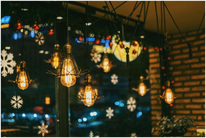 Warm and festive cafe ambiance with hanging bulbs