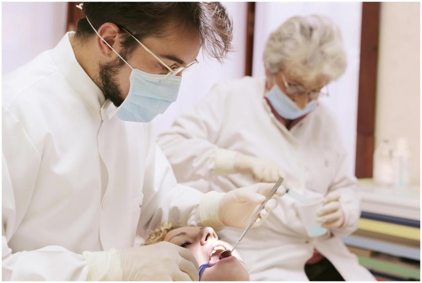 Dentists performing a dental check-up in a clinica
