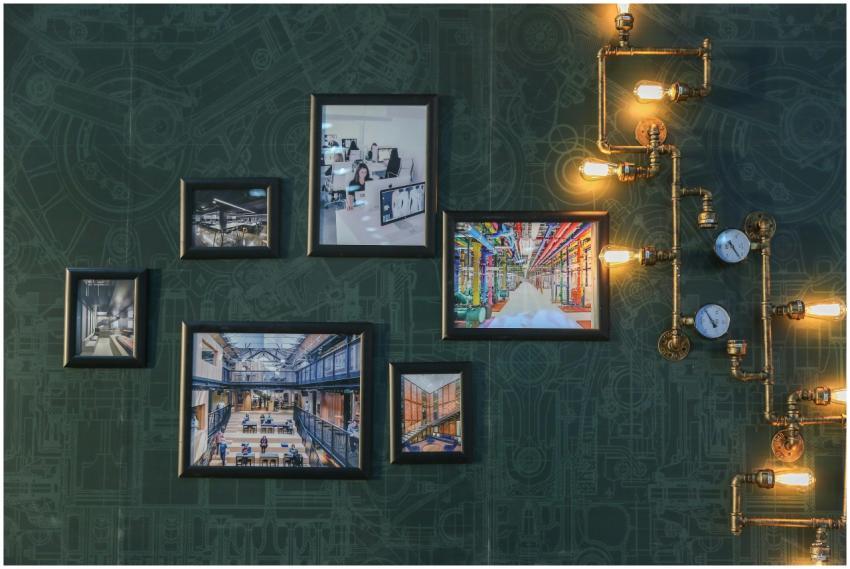 Industrial style wall art with vintage pipe lighti