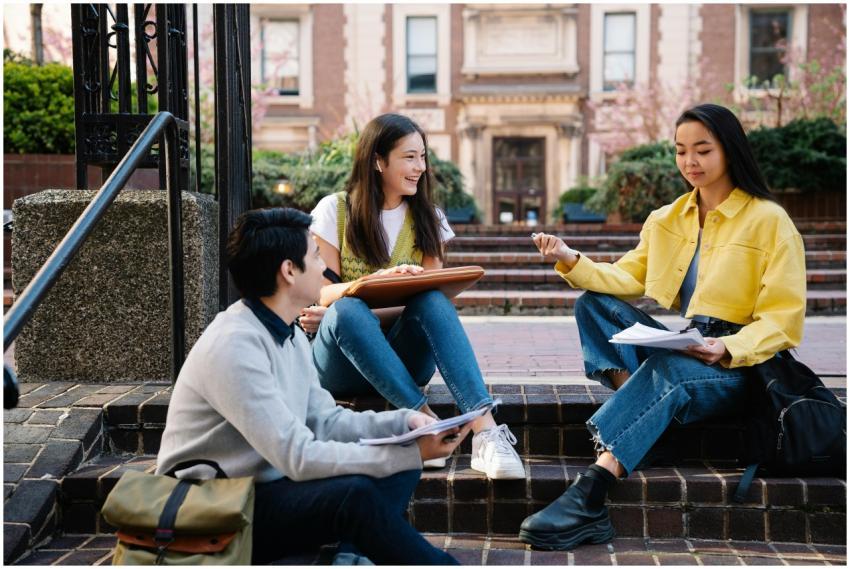 A group of college students sitting and discussing
