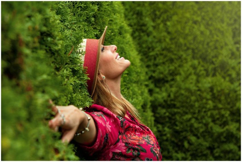 A joyful woman enjoying nature, embracing freedom