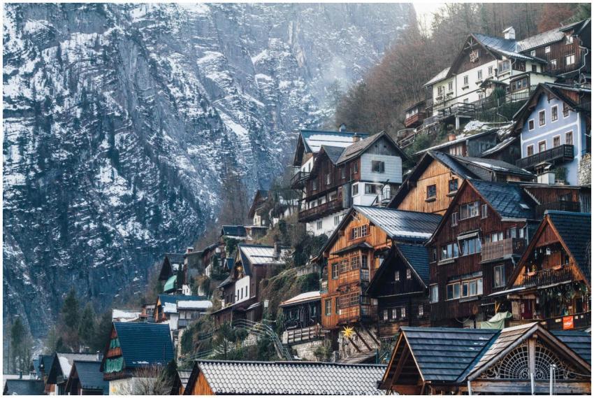 Charming wooden homes nestled on a snowy cliffside