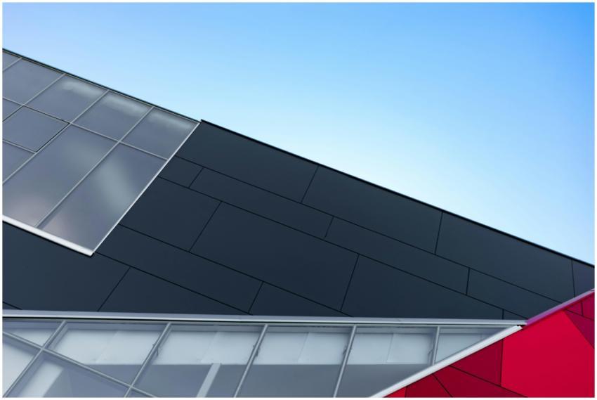 A modern building facade with geometric glass and