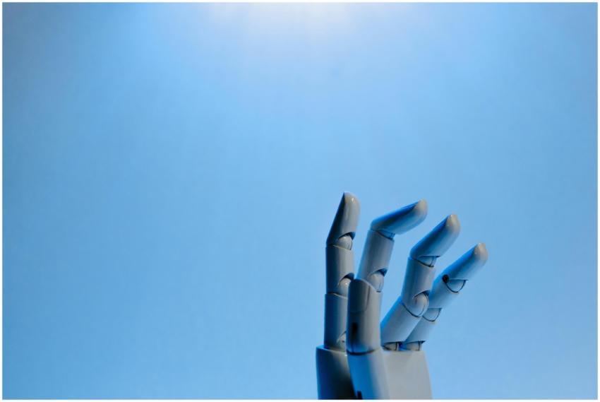 Robotic hand with articulated fingers reaching tow