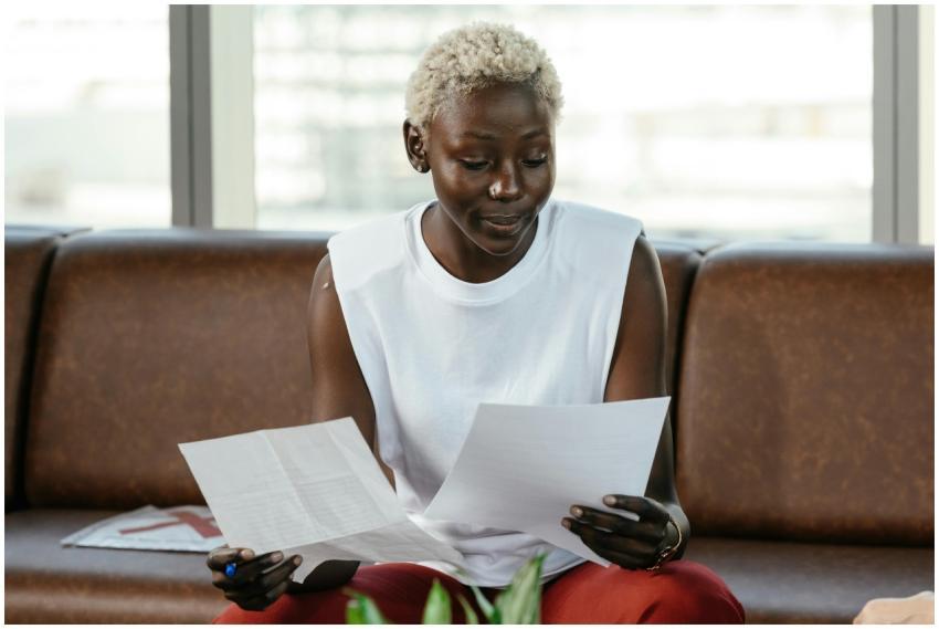 Concentrated African American female comparing imp