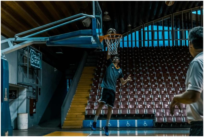 Athletes practicing basketball shoots during an in