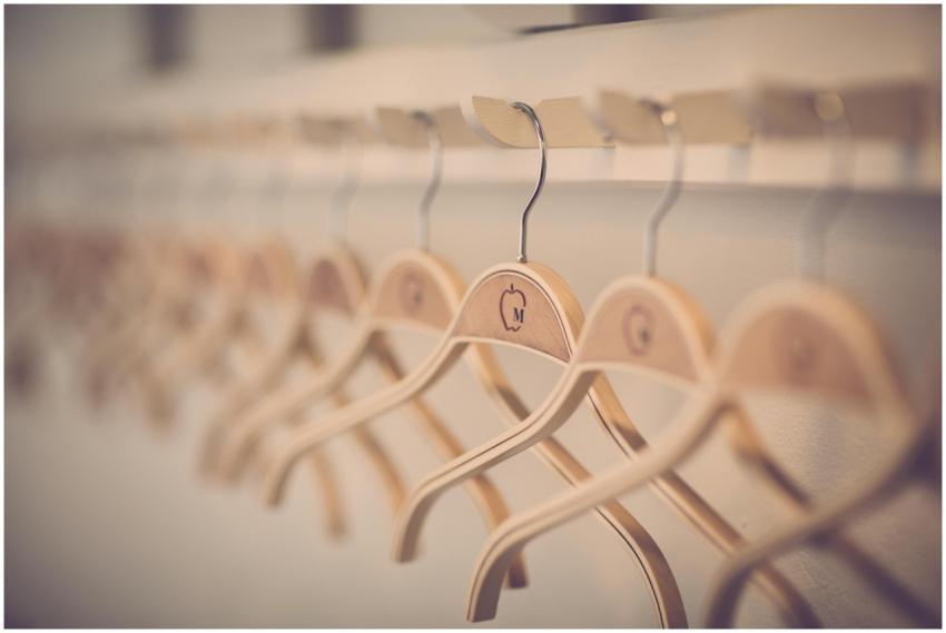 Close-up of neatly organized wooden hangers in a m