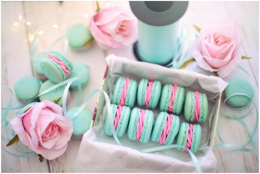 A delightful display of pastel macarons with pink