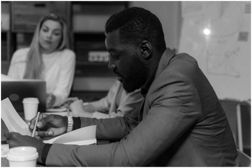 Focused businessman working in a monochrome office