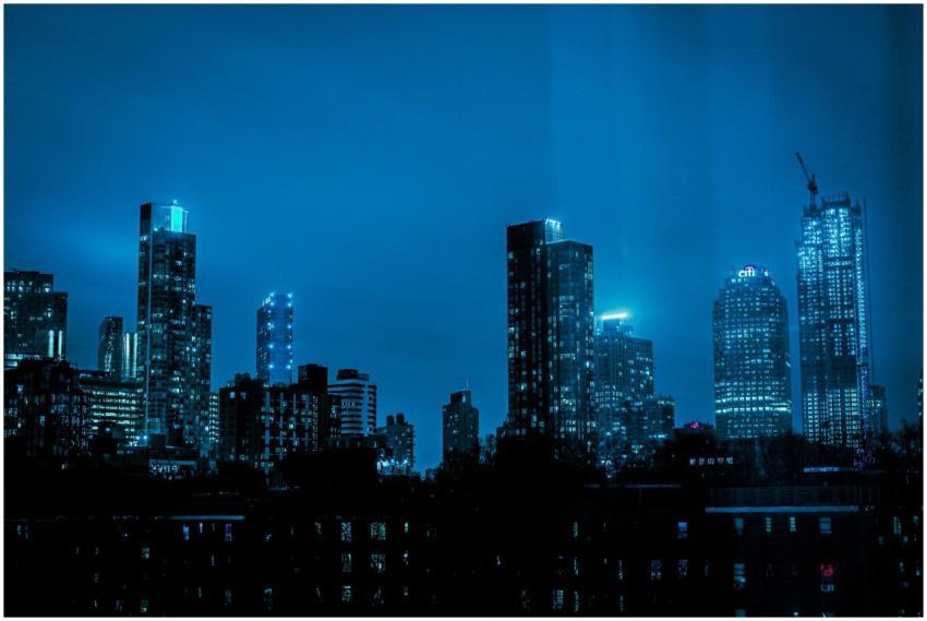 Explore the illuminated skyline with high-rise bui