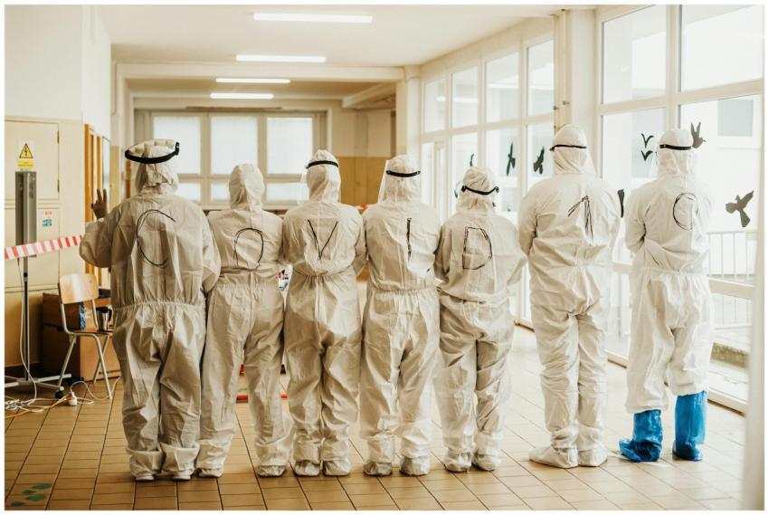 Healthcare professionals in PPE suits with COVID-1