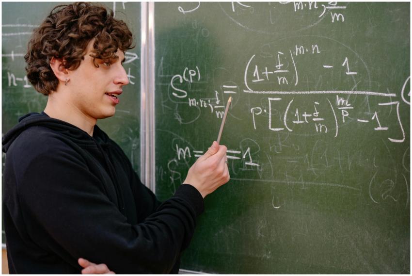 A young male educator explaining complex math equa
