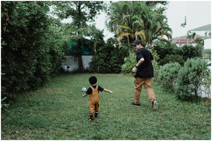 Father and son bonding over a game of football in