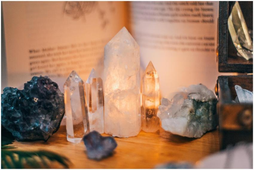 Close-up of various healing crystals on a wooden t