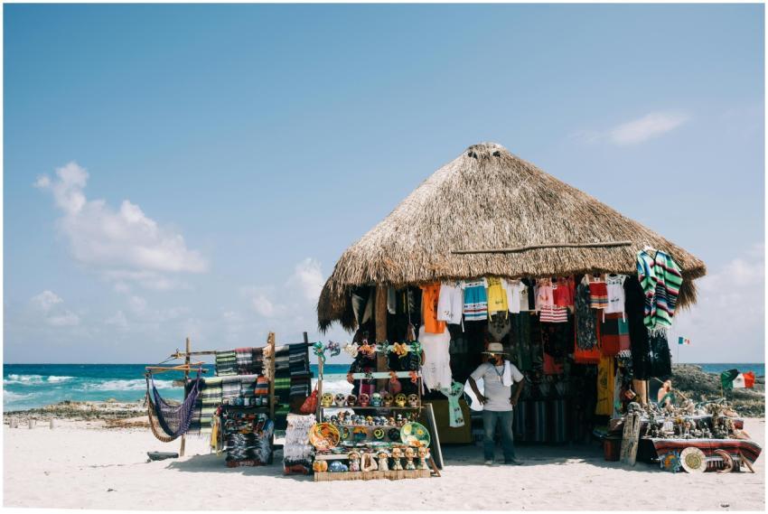 Beachfront market stall selling traditional clothi