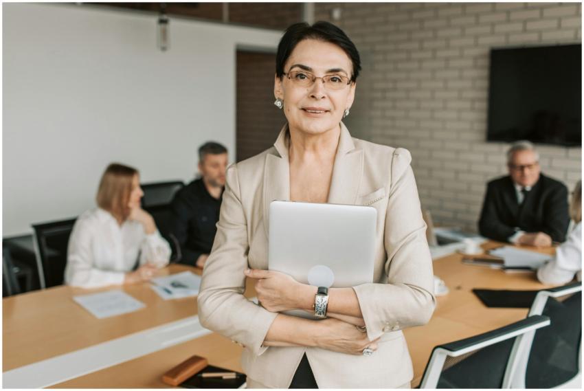 Professional businesswoman holding a tablet in a c