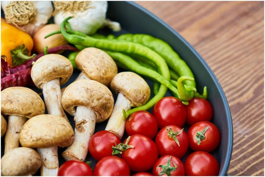 A close-up of various fresh vegetables and mushroo