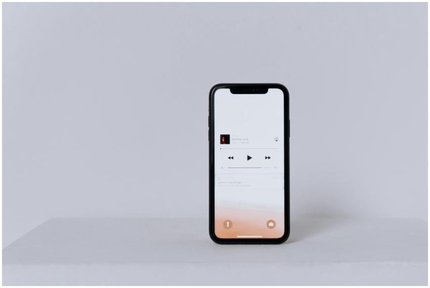 A minimalist smartphone displaying a music app set