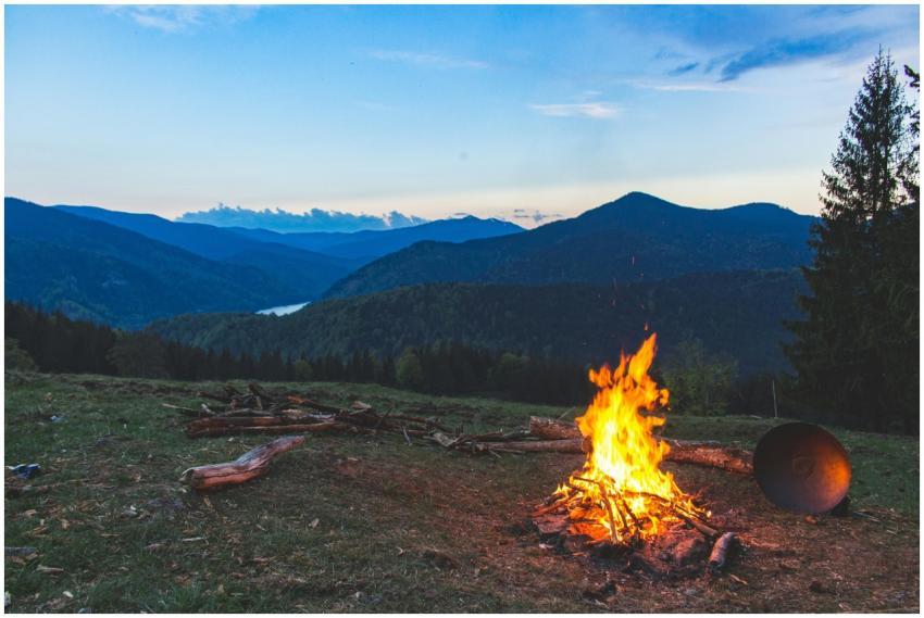 Cozy campfire against a mountain backdrop at twili