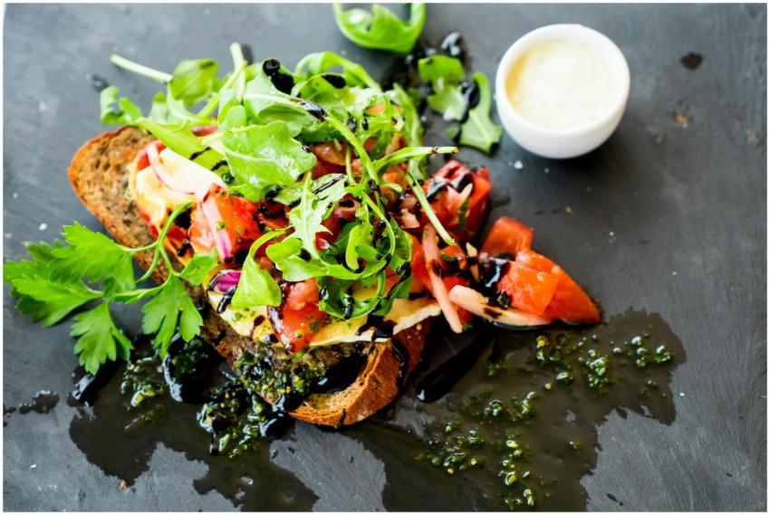 Delicious bruschetta with fresh herbs, tomatoes, a