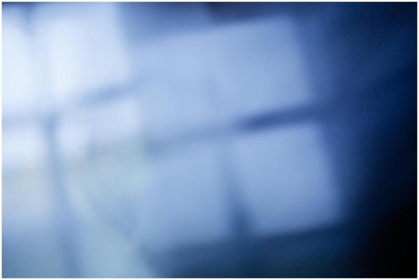 Abstract blurred image of blue light through a win