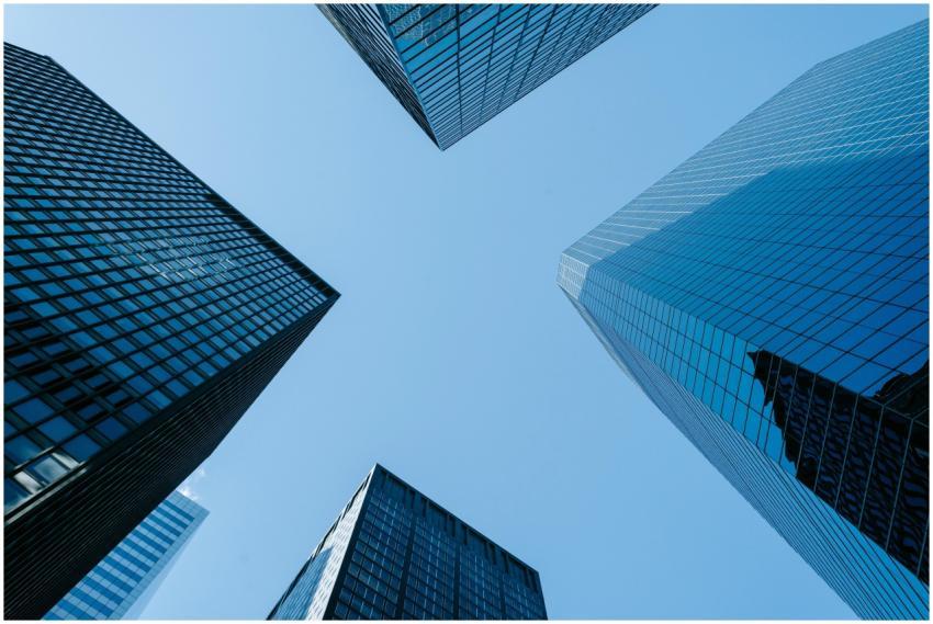 Low angle of high business towers with glass mirro